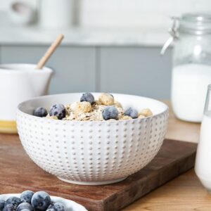 minimal neutral decorative bowl styled on entryway table