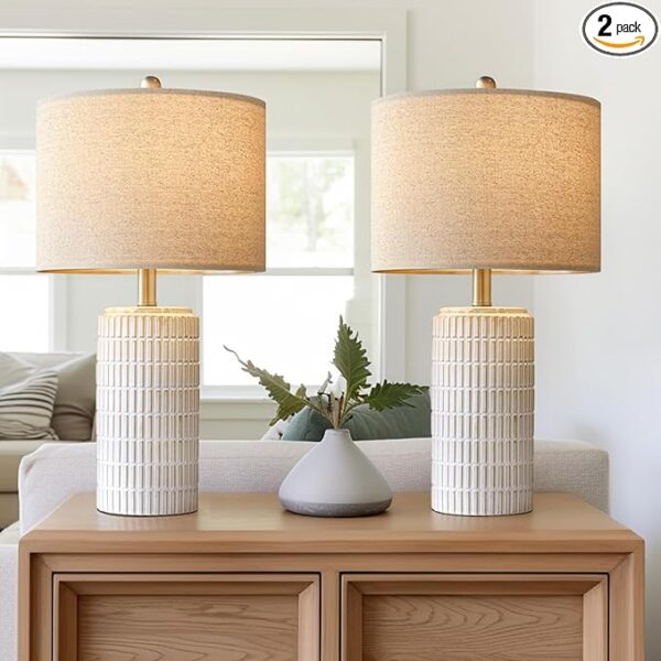 Warm Neutral Ceramic Lamp for Cozy Modern Bedroom Decor Neutral ceramic table lamp with warm ambient lighting styled on a wood nightstand in a cozy organic modern bedroom