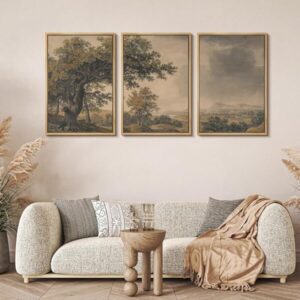 Neutral bedroom with wooden bed and soft gray bedding, featuring a 3 piece framed landscape wall art set above the bed creating a calm minimalist look