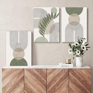 Sage green minimalist wall art set with botanical geometric design displayed above a neutral sofa in a modern living room