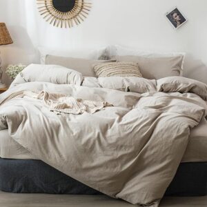 Neutral linen style comforter layered in cozy modern bedroom