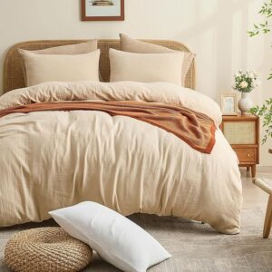 Neutral muslin duvet cover styled in soft minimal bedroom