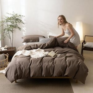 Minimalist neutral comforter set styled in bright cozy bedroom